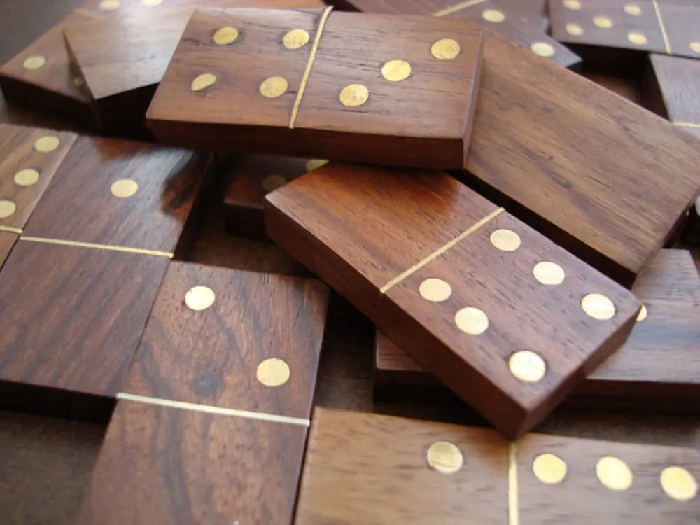 Dominoes are made of wood with metal parts
