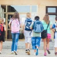 Group of kids going to school together poker