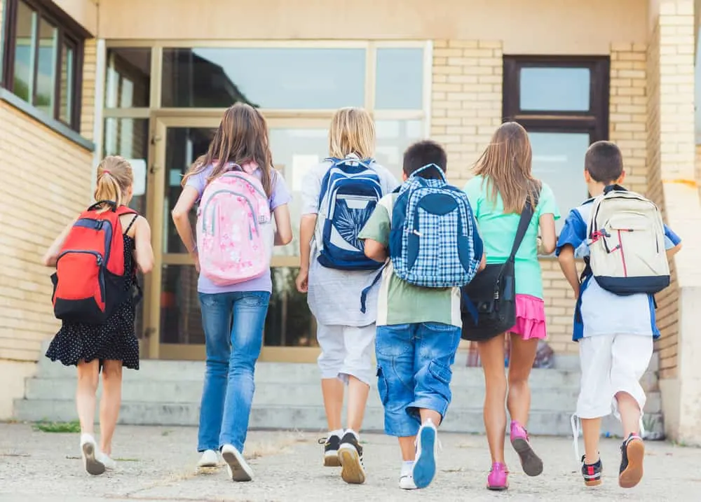 Group of kids going to school together poker