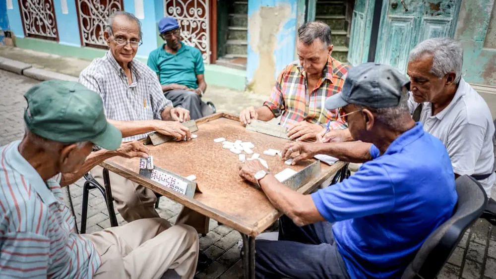 Old friends make Dominos play on the Havana street