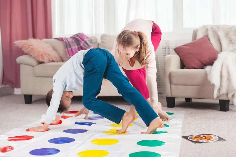 mother playing twister with her son
