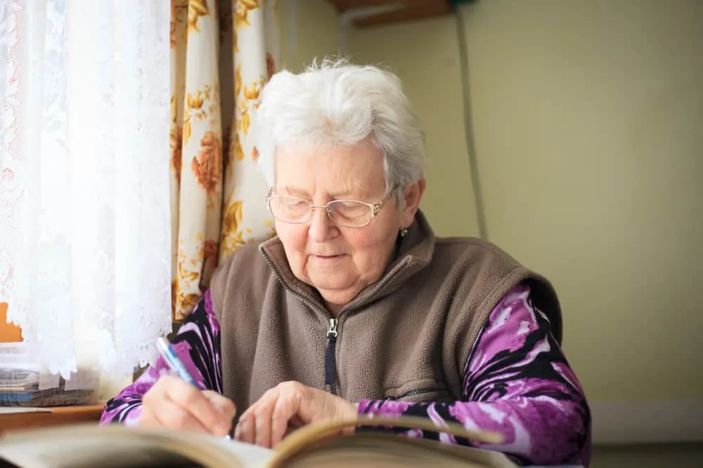 senior woman lusting a sudoku