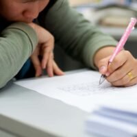 woman solving sudoku problem