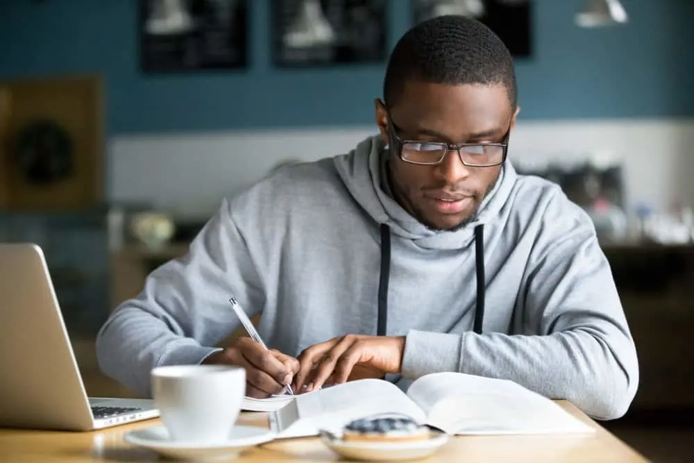 Focused millennial african american student poker