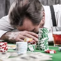 poker table with money and gambling chips