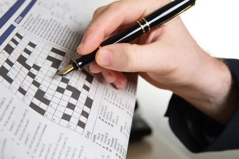 Businessman doing crossword