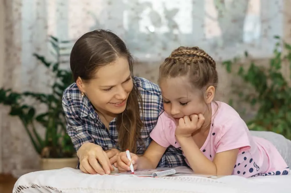 Mother and daughter doing crosswords