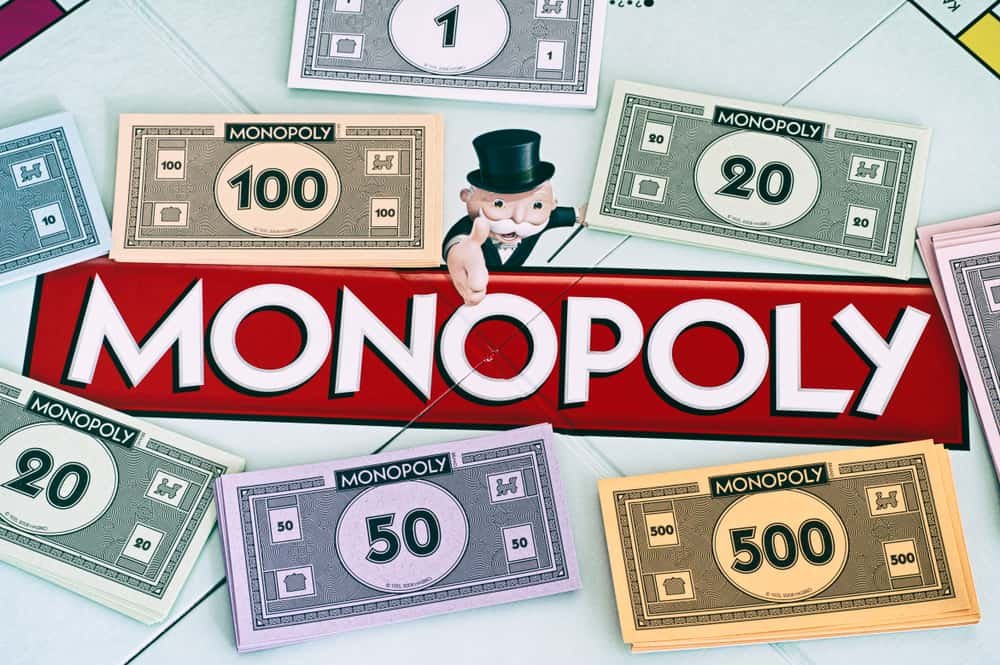 Center of Monopoly gameboard with money packs