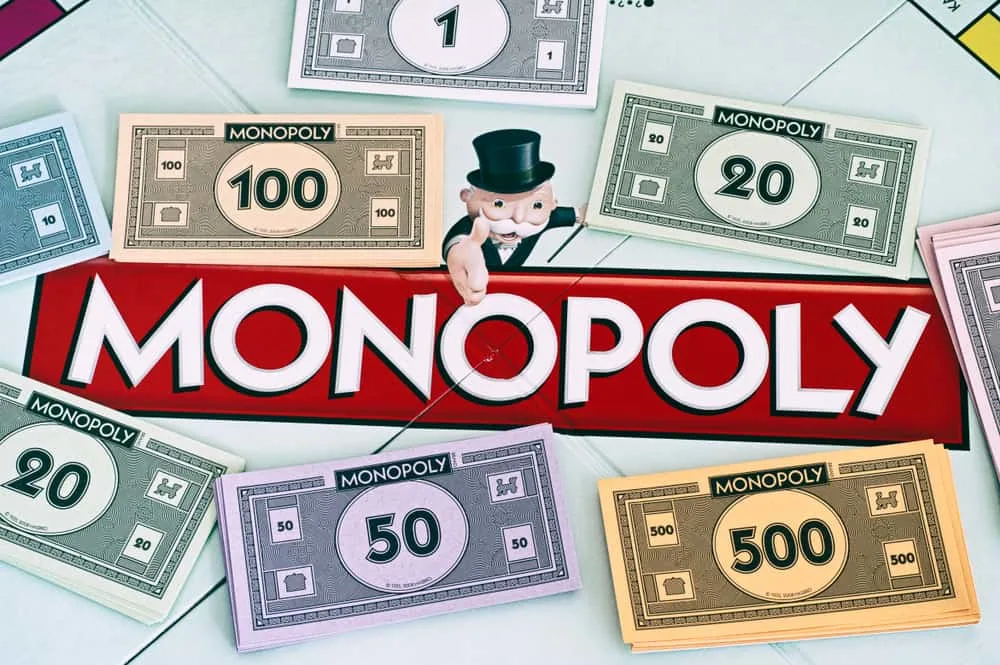 Center of Monopoly gameboard with money packs