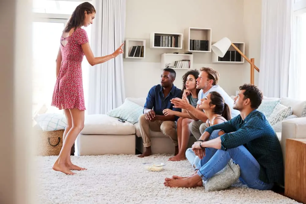 Friends At Home Having Fun Playing Charades Together 2
