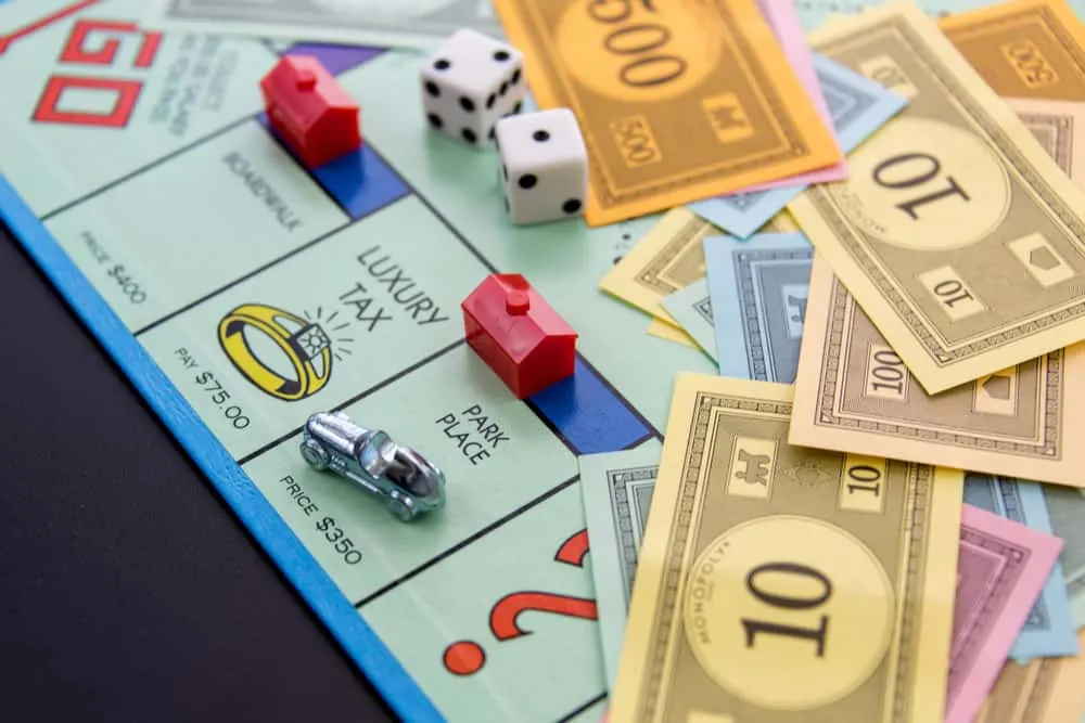 Monopoly game board with car on Park Place