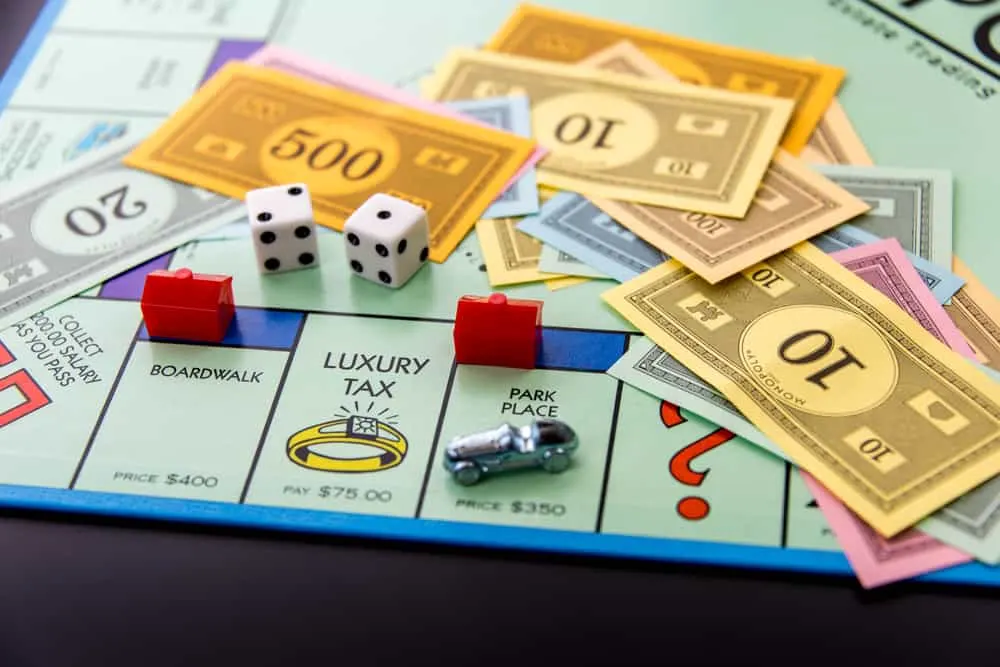Monopoly game board with car on Park Place