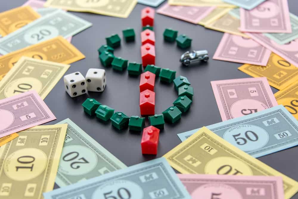 Monopoly money around houses and hotels