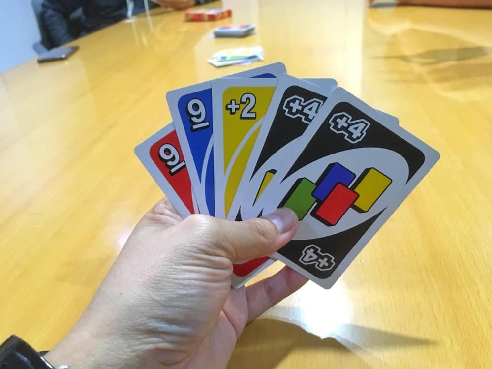 Man hand holding UNO cards