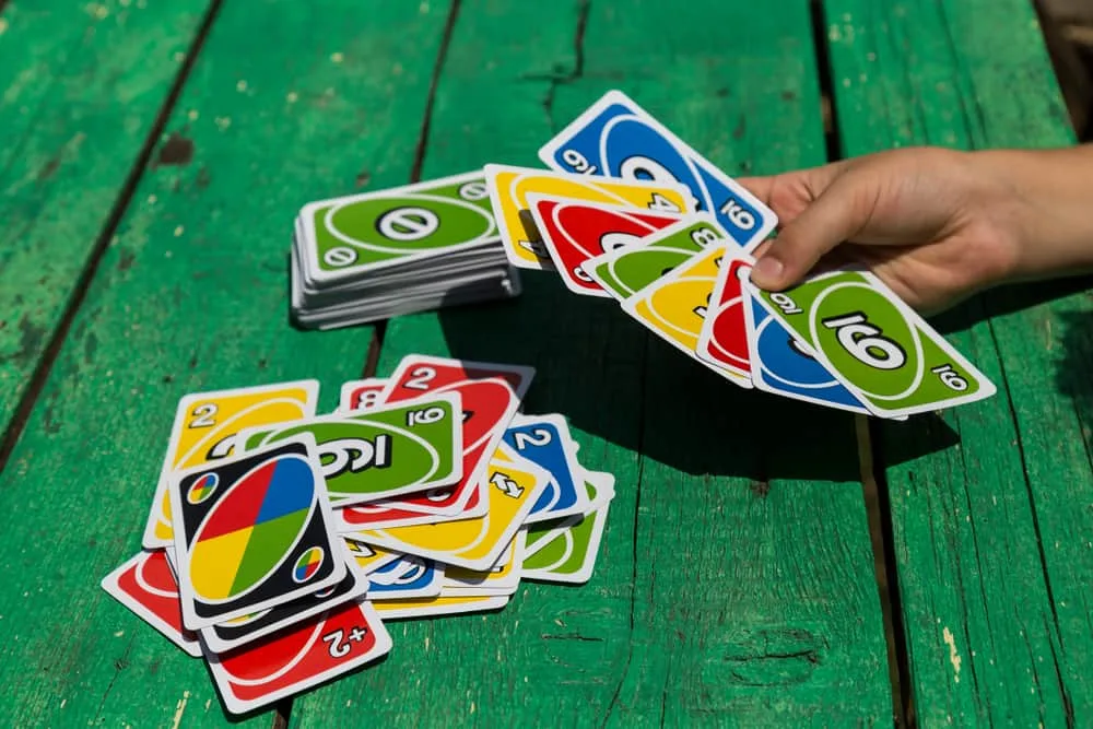 card game UNO on green table