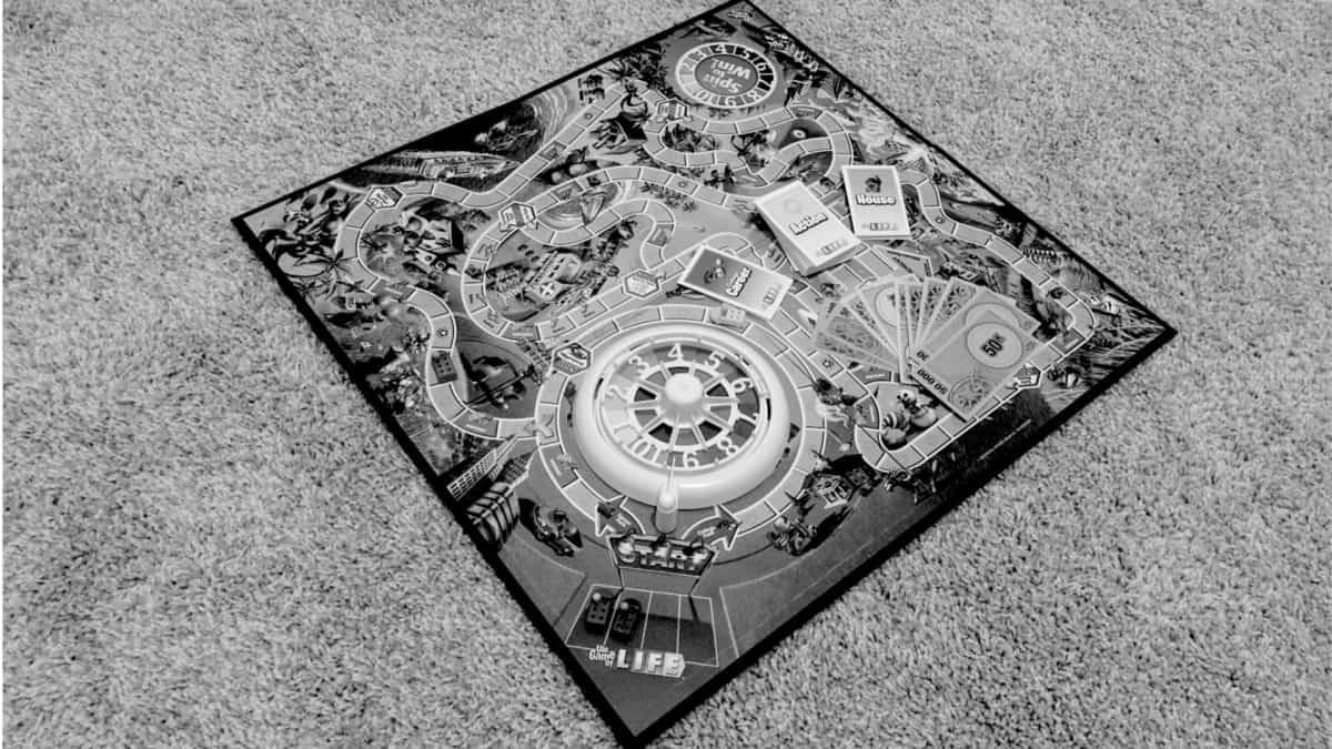 Game of Life with game pieces on the board (white and black)