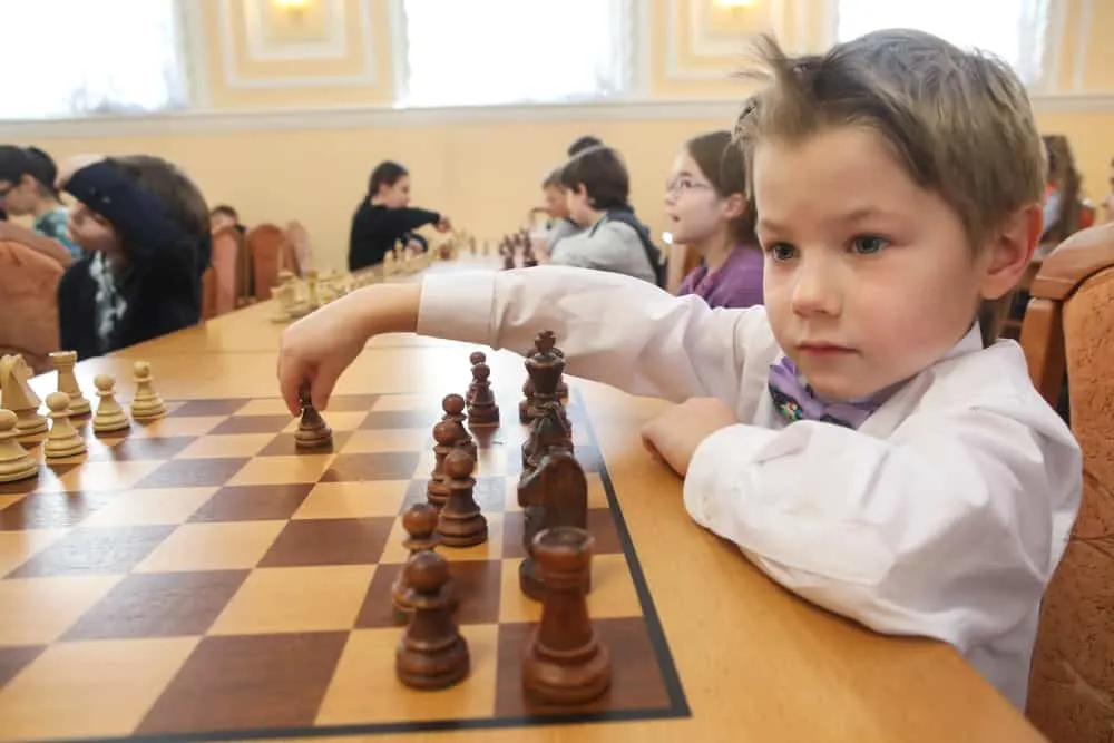 Saint Petersburg, Russia - Chess pieces on a chess Board. Children play chess