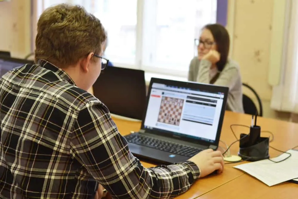 Syktyvkar, Russia - Children play chess online on laptops in school