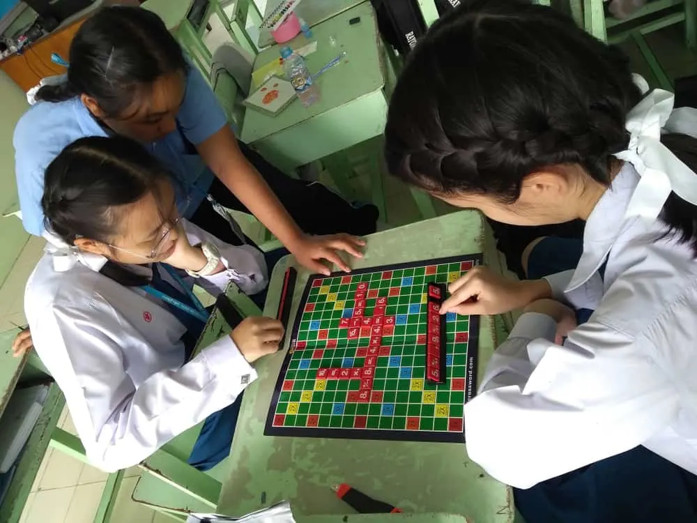 High school school students play a mathematics version of the famous Scrabble board game