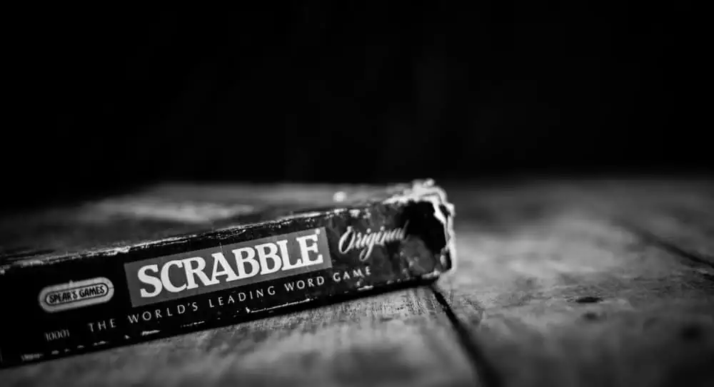 Old Scrabble Box on Vintage Wooden Table