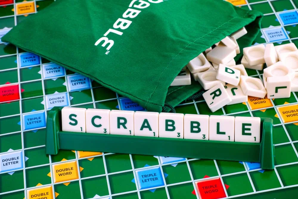 Scrabble Board Game. Word Scrabble from letter tiles in the tile rack on gameboard