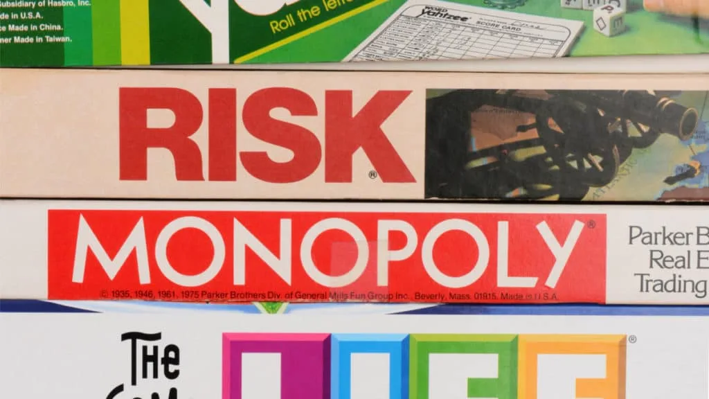 Stack of Board Games, including Monopoly and Risk