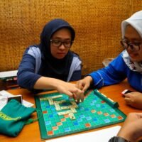 Two woman playing Scrabble