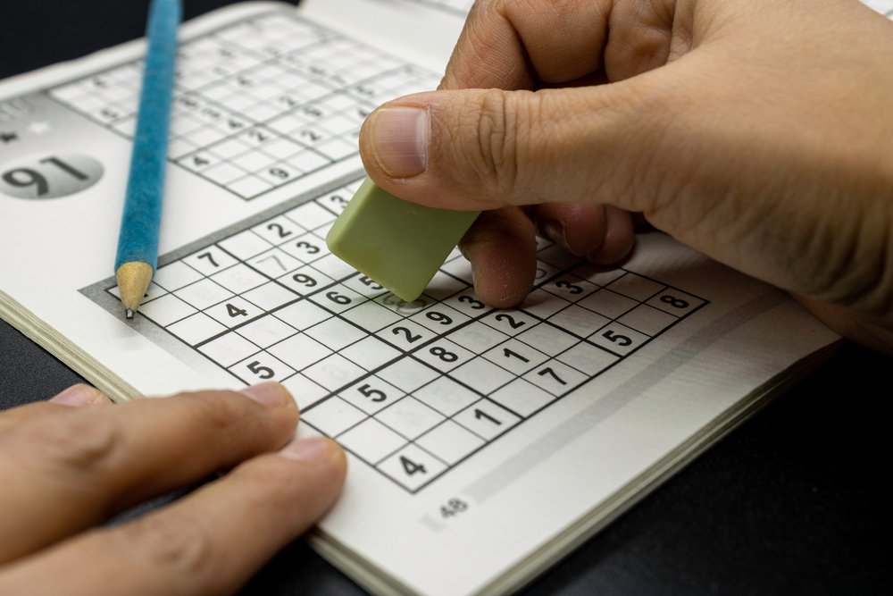 Person playing Sudoku