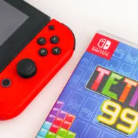 Tetris 99 video game box and Nintendo Switch