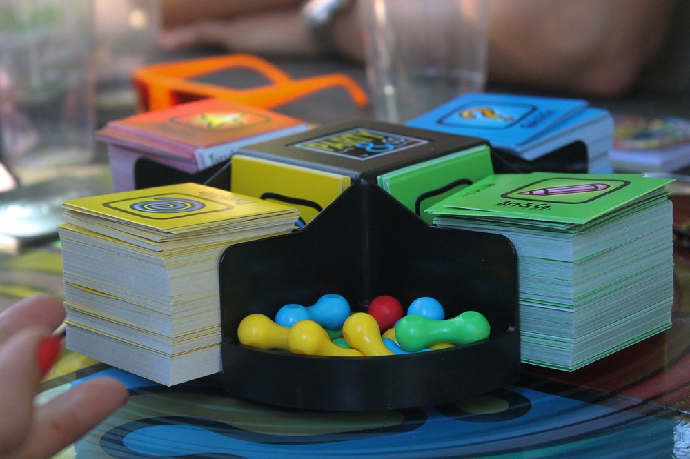 Close-up of Pictionary, a board game with cards and playing chips of colors