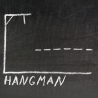 Hangman Chalk Writing on Old Grunge Chalkboard