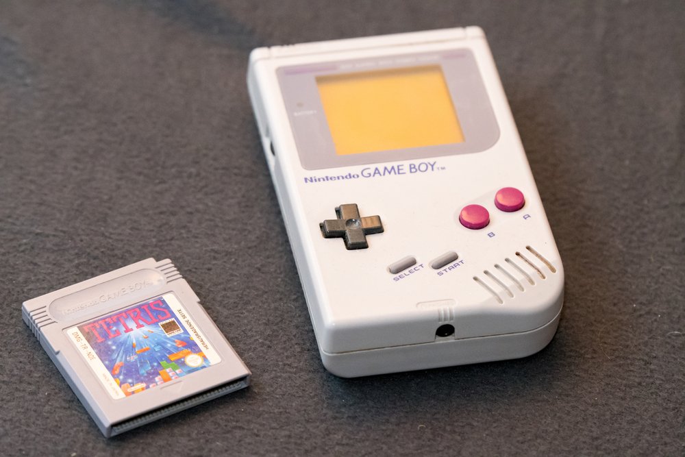 Nintendo Gamboy on grey background with a tetris game