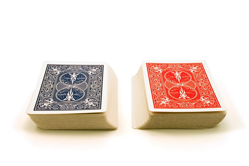 Two decks of cards against a white background