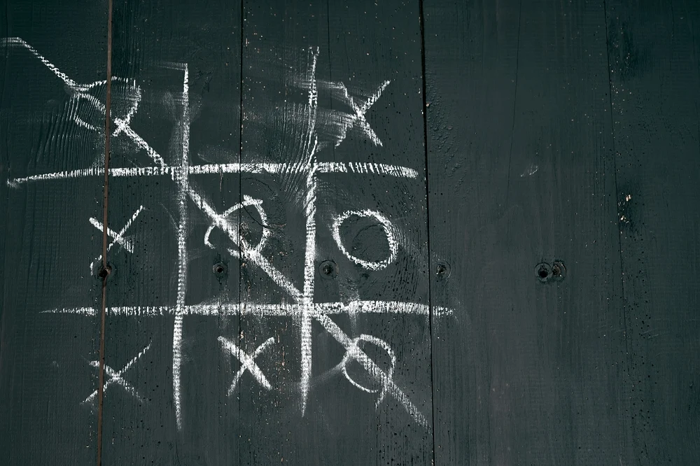 old black wooden door, tic-tac-toe game