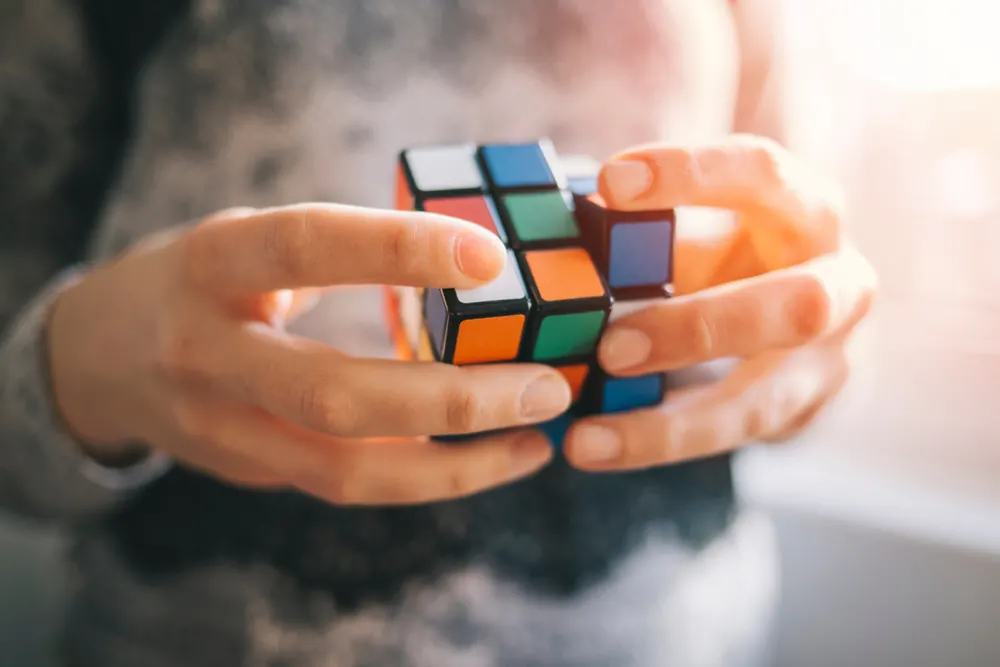 Close up of woman holding Rubik's cube