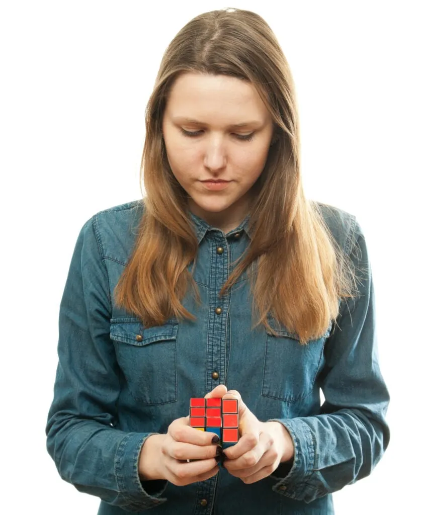 Girl playing a cube game.