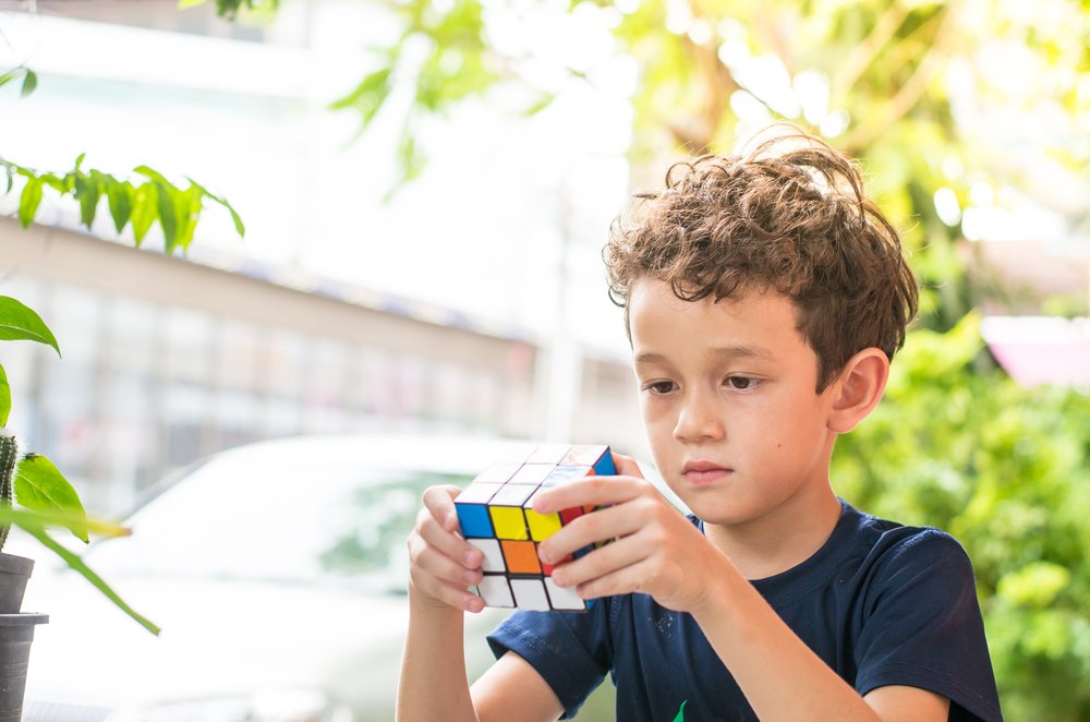 boy playing with the Rubik's Cube