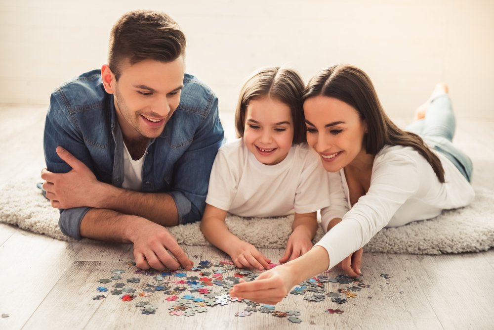 girl-and-her-parents-are-doing-jigsaw-puzzle.jpg