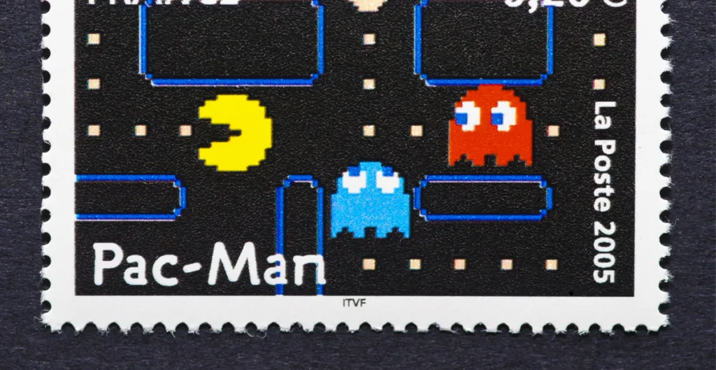 postage stamp printed in France showing an image of Pac-Man