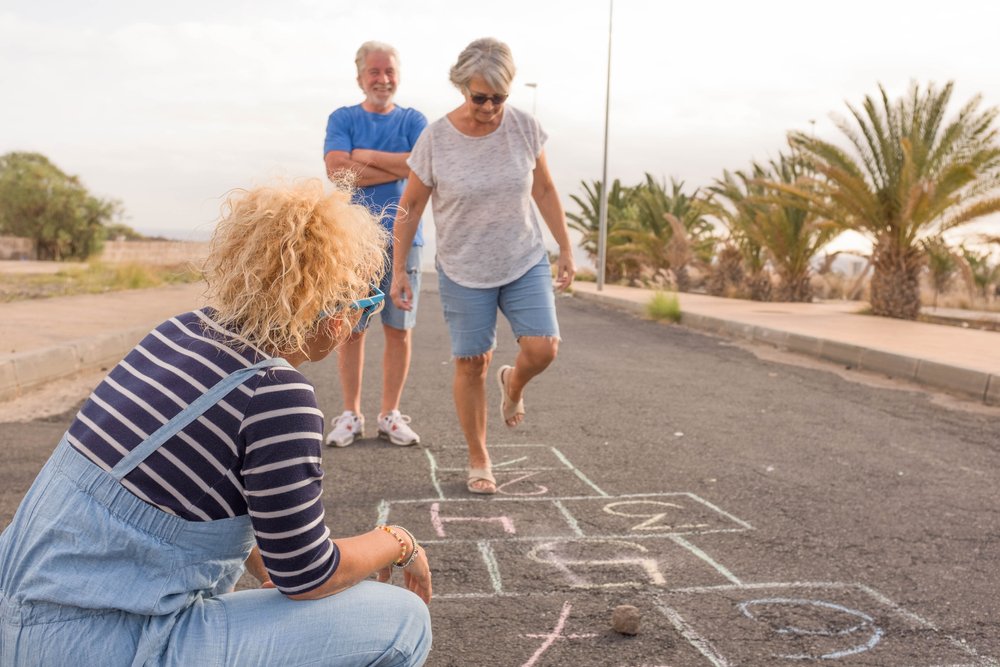seniors playing at hopscotch