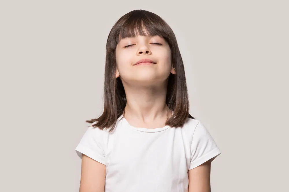 wellbeing concept rest kid meditating